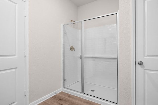 10029 Pilot Pl, Fort Worth, TX 76131 - full bathroom featuring a shower stall, wood finished floors, and baseboards