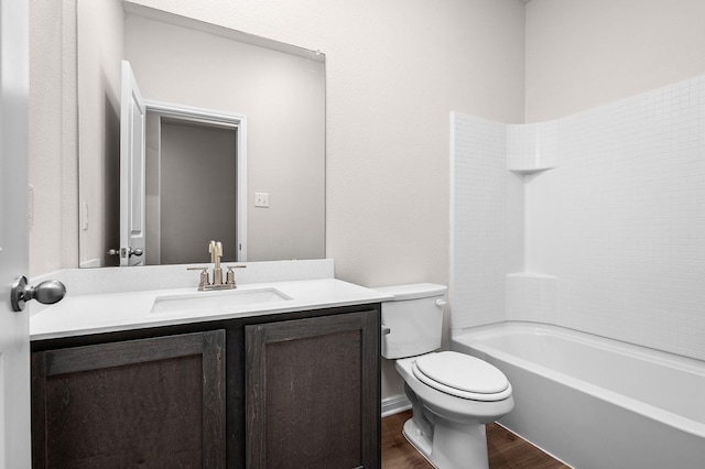 10029 Pilot Pl, Fort Worth, TX 76131 - bathroom with wood finished floors, toilet, vanity, and washtub / shower combination