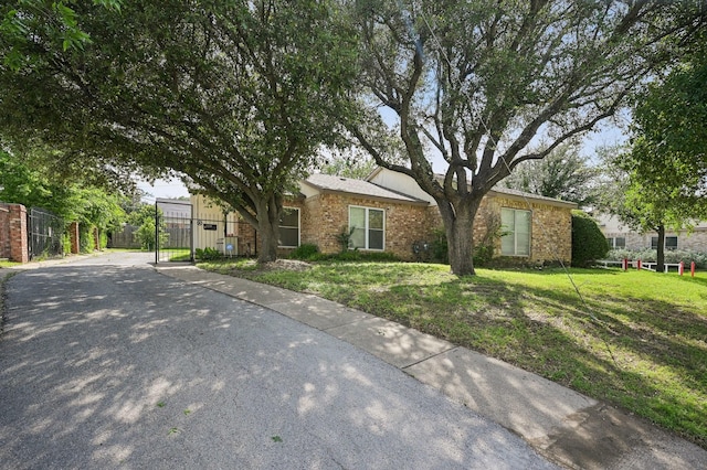 8609 N Normandale St, Fort Worth, TX 76116 - view of front facade featuring a gate and brick siding