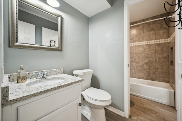8609 N Normandale St, Fort Worth, TX 76116 - full bathroom with wood tiled floors, vanity, and washtub / shower combination