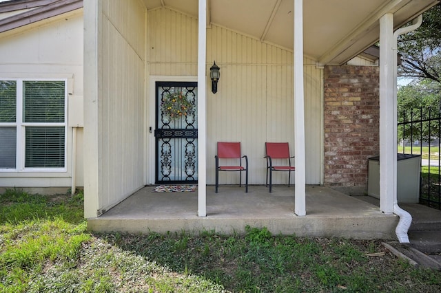 8609 N Normandale St, Fort Worth, TX 76116 - doorway to property featuring covered porch and brick siding