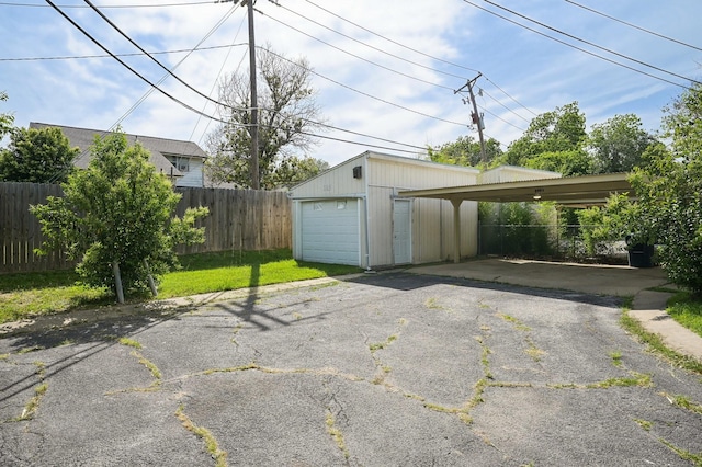 8609 N Normandale St, Fort Worth, TX 76116 - garage featuring asphalt driveway and a garage