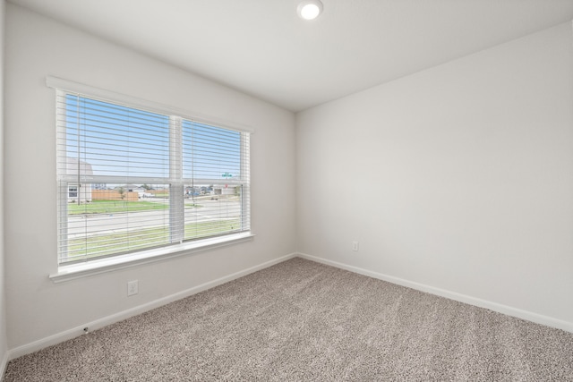 4703 Fillmore Dr, Greenville, TX 75401 - spare room featuring carpet floors and baseboards