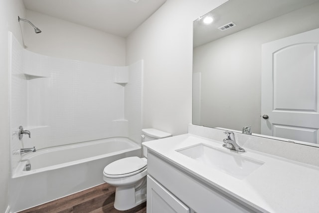 4703 Fillmore Dr, Greenville, TX 75401 - bathroom with wood finished floors, toilet, shower / tub combination, and vanity