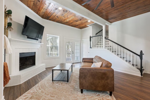 724 N Old Robinson Rd, Robinson, TX 76706 - living room featuring stairway, wood ceiling, wood finished floors, baseboards, and a fireplace with raised hearth