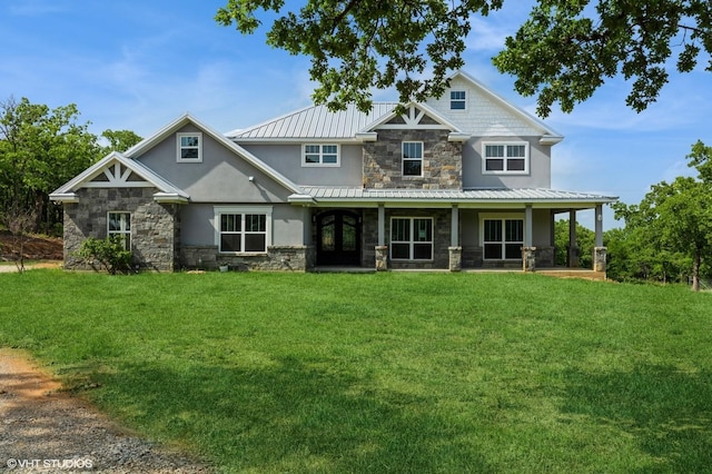 344 Whispering Oaks Trl, Sunset, TX 76270 - view of front of property featuring stone siding, stucco siding, a front yard, and metal roof