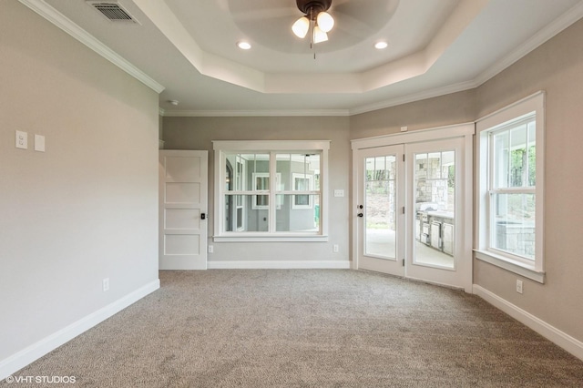344 Whispering Oaks Trl, Sunset, TX 76270 - carpeted empty room with healthy amount of natural light, a raised ceiling, a ceiling fan, crown molding, and baseboards