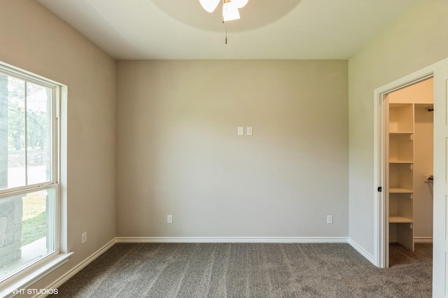 344 Whispering Oaks Trl, Sunset, TX 76270 - unfurnished bedroom featuring a walk in closet, carpet flooring, and baseboards