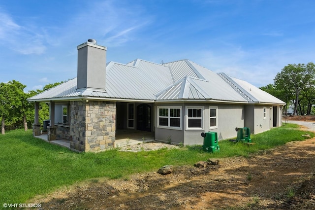 344 Whispering Oaks Trl, Sunset, TX 76270 - rear view of house featuring a chimney, a patio, and metal roof