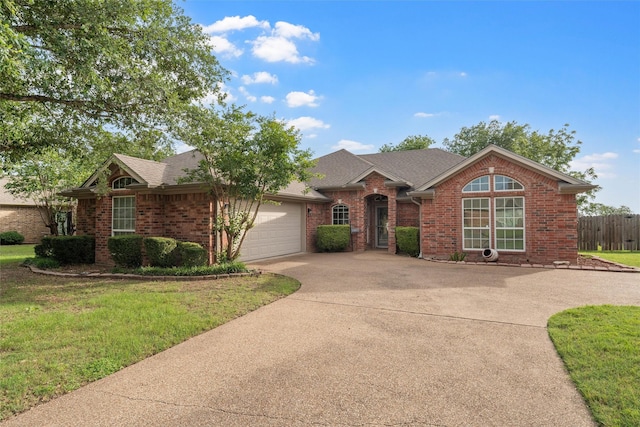 608 Shoal Rdg S, Lorena, TX 76655 - view of front facade featuring brick siding, an attached garage, concrete driveway, and roof with shingles