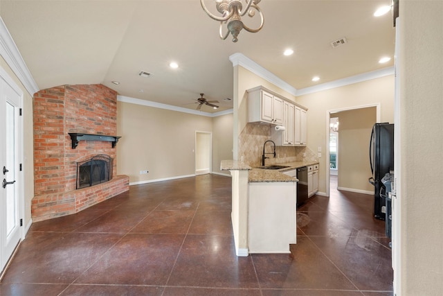 608 Shoal Rdg S, Lorena, TX 76655 - kitchen with a sink, open floor plan, a peninsula, light stone countertops, and baseboards