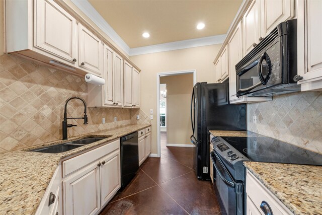 608 Shoal Rdg S, Lorena, TX 76655 - kitchen featuring black appliances, a sink, decorative backsplash, ornamental molding, and dark tile patterned floors