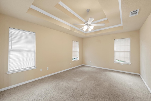 608 Shoal Rdg S, Lorena, TX 76655 - unfurnished room featuring a tray ceiling, carpet floors, a ceiling fan, baseboards, and ornamental molding