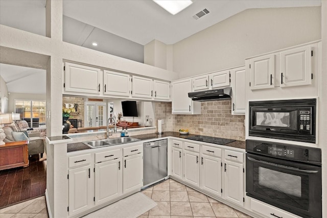 3507 Jasmine Ln, Rowlett, TX 75089 - kitchen featuring black appliances, a sink, under cabinet range hood, white cabinets, and high vaulted ceiling