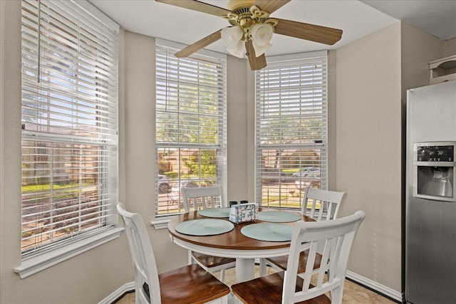 3507 Jasmine Ln, Rowlett, TX 75089 - dining area featuring a ceiling fan, healthy amount of natural light, baseboards, and light tile patterned floors