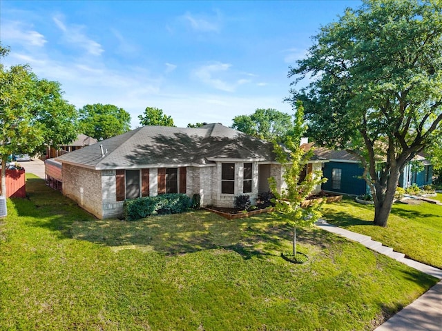 3507 Jasmine Ln, Rowlett, TX 75089 - ranch-style house featuring a front lawn, roof with shingles, and brick siding