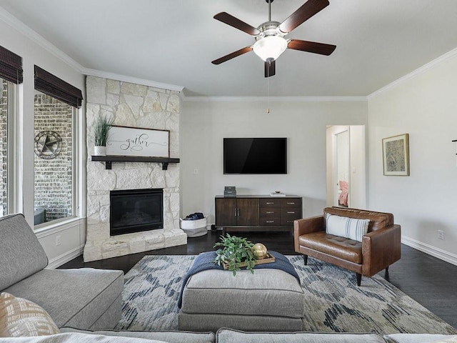 2812 Castlereach St, Trophy Club, TX 76262 - living area featuring dark wood-style floors, crown molding, baseboards, ceiling fan, and a stone fireplace