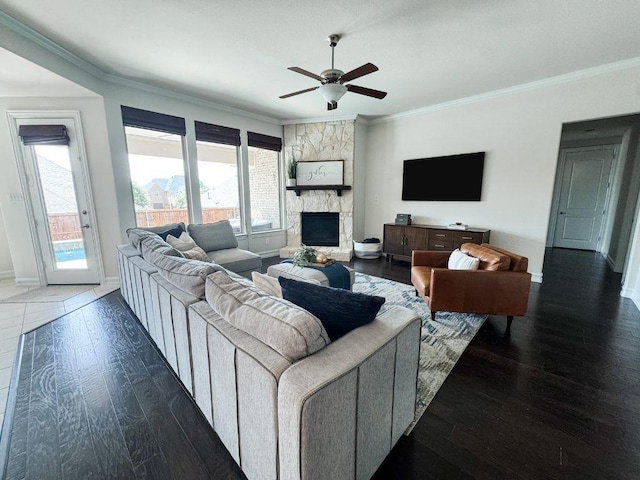 2812 Castlereach St, Trophy Club, TX 76262 - living area with ceiling fan, crown molding, wood finished floors, plenty of natural light, and a stone fireplace
