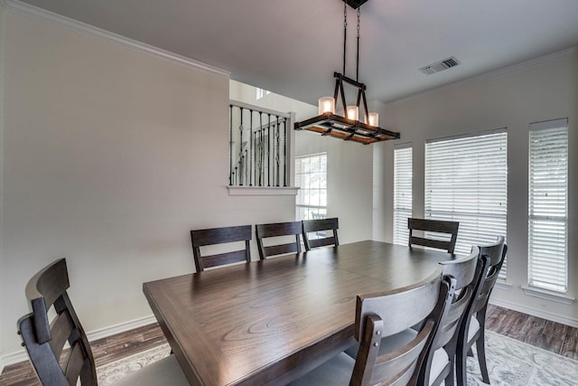 566 Glenn Ln, Red Oak, TX 75154 - dining space featuring wood finished floors, baseboards, ornamental molding, and a chandelier