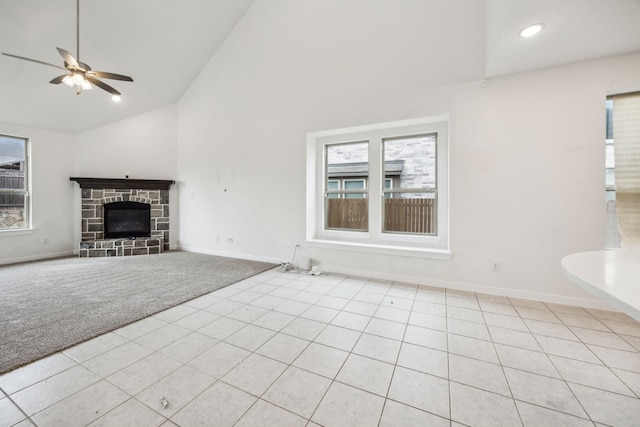 3903 Rochelle Ln, Forney, TX 75126 - unfurnished living room featuring plenty of natural light, ceiling fan, light carpet, light tile patterned floors, and high vaulted ceiling
