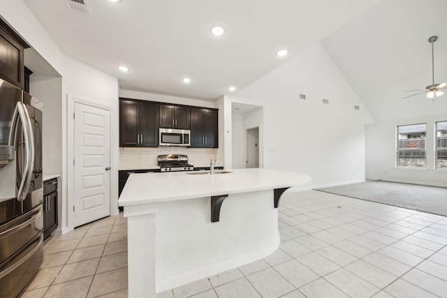 3903 Rochelle Ln, Forney, TX 75126 - kitchen featuring stainless steel appliances, a sink, open floor plan, light countertops, and a ceiling fan