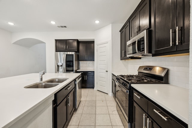 3903 Rochelle Ln, Forney, TX 75126 - kitchen with appliances with stainless steel finishes, a sink, decorative backsplash, light countertops, and recessed lighting