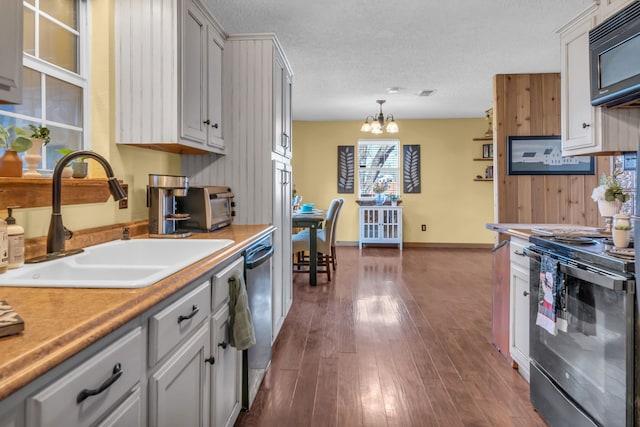 836 Silver Creek Rd, Azle, TX 76020 - kitchen featuring range with electric cooktop, a sink, black microwave, dishwasher, and a chandelier
