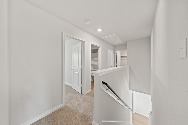 4701 Fillmore Dr, Greenville, TX 75401 - corridor with an upstairs landing, attic access, baseboards, and light colored carpet