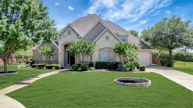 807 Gateshead Ct, Southlake, TX 76092 - french country inspired facade with stone siding, driveway, brick siding, and a garage