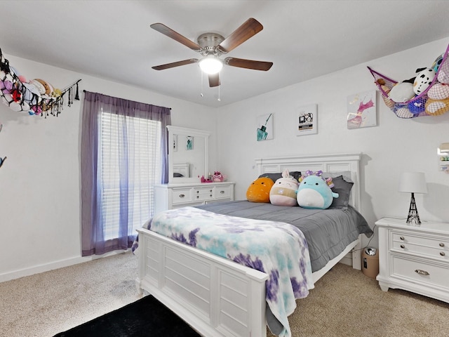 5601 Briarcrest Dr, Garland, TX 75043 - bedroom with light colored carpet, a ceiling fan, and baseboards