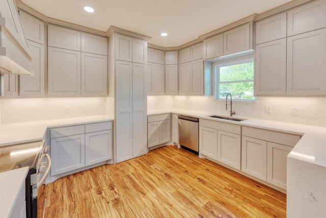 808 N Main St, Tioga, TX 76233 - kitchen with a sink, appliances with stainless steel finishes, light wood finished floors, tasteful backsplash, and custom range hood