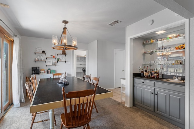 3410 Country Club Pl, Grand Prairie, TX 75052 - dining area featuring wet bar, a chandelier, and light carpet