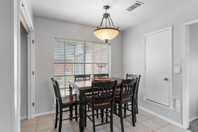 3410 Country Club Pl, Grand Prairie, TX 75052 - dining space featuring light tile patterned floors and baseboards