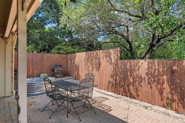 3410 Country Club Pl, Grand Prairie, TX 75052 - view of patio / terrace with fence and outdoor dining area