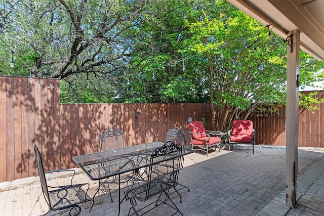 3410 Country Club Pl, Grand Prairie, TX 75052 - view of patio / terrace featuring fence and outdoor dining space