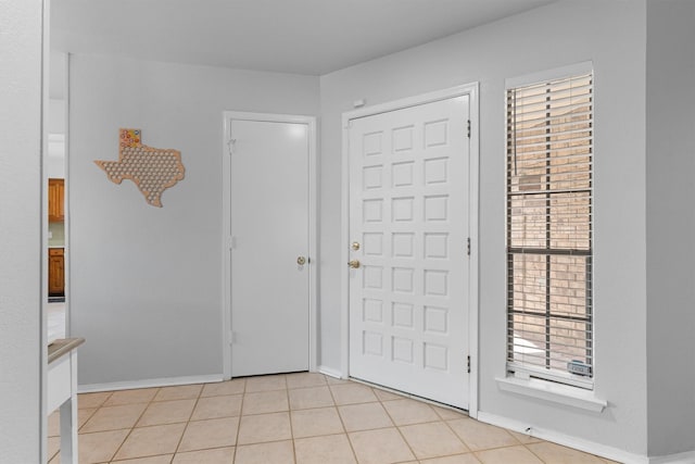 3410 Country Club Pl, Grand Prairie, TX 75052 - foyer featuring baseboards and light tile patterned floors