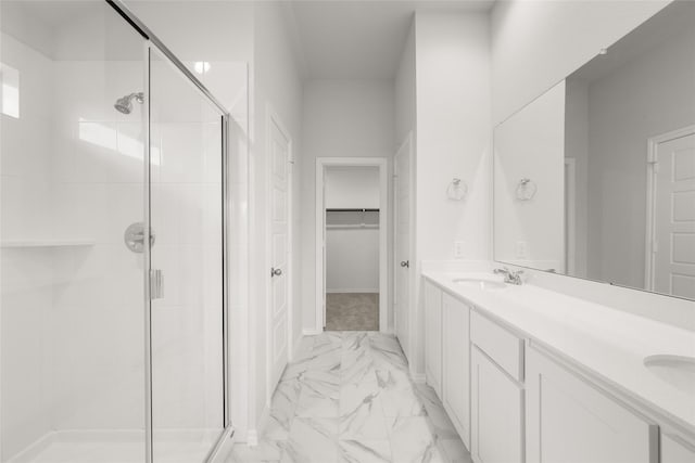 9332 Bali Dr, Fort Worth, TX 76123 - bathroom with marble look tiles, a stall shower, double vanity, and a spacious closet