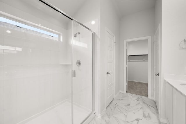 9332 Bali Dr, Fort Worth, TX 76123 - full bathroom with a shower stall, marble look tiles, a spacious closet, and vanity