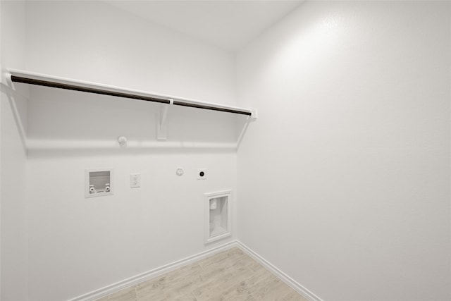 9332 Bali Dr, Fort Worth, TX 76123 - laundry room with hookup for a gas dryer, electric dryer hookup, baseboards, light wood-type flooring, and hookup for a washing machine