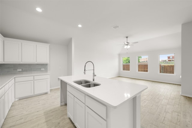 9332 Bali Dr, Fort Worth, TX 76123 - kitchen featuring a sink, a ceiling fan, tasteful backsplash, light countertops, and recessed lighting