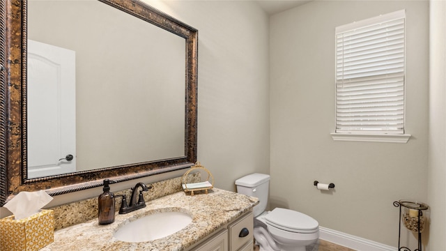 5100 Ambergate Ln, Sherman, TX 75092 - bathroom with toilet, vanity, and baseboards
