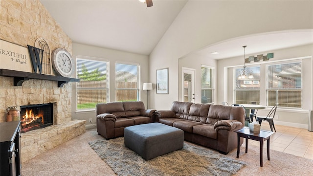 5100 Ambergate Ln, Sherman, TX 75092 - carpeted living room with a fireplace, high vaulted ceiling, arched walkways, baseboards, and a ceiling fan