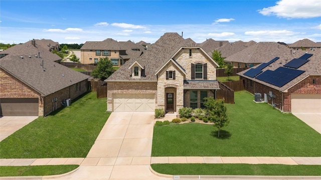 5100 Ambergate Ln, Sherman, TX 75092 - french country style house with stone siding, driveway, a residential view, brick siding, and a garage