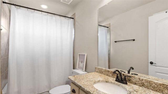 5100 Ambergate Ln, Sherman, TX 75092 - bathroom with toilet, vanity, a shower with shower curtain, and recessed lighting