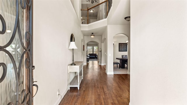 5100 Ambergate Ln, Sherman, TX 75092 - foyer with arched walkways, baseboards, a high ceiling, and dark wood-style floors