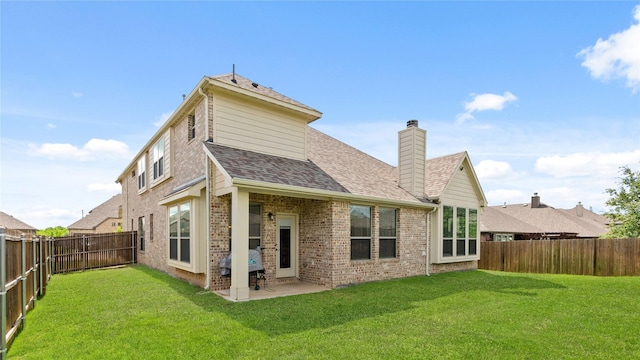 5100 Ambergate Ln, Sherman, TX 75092 - back of house featuring a chimney, brick siding, a shingled roof, and a patio