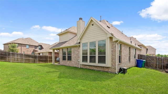 5100 Ambergate Ln, Sherman, TX 75092 - back of property featuring brick siding, a chimney, and roof with shingles