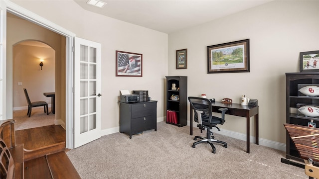 5100 Ambergate Ln, Sherman, TX 75092 - home office with arched walkways, carpet flooring, and baseboards