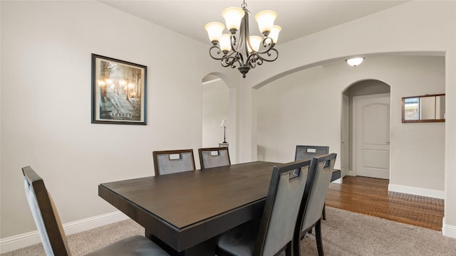 5100 Ambergate Ln, Sherman, TX 75092 - carpeted dining area featuring arched walkways, a chandelier, and baseboards