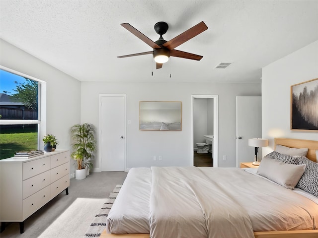110 Nighthawk Dr, Krum, TX 76249 - carpeted bedroom with ceiling fan and ensuite bathroom